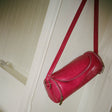 Pink skuldertaske i PU med blød silhuet