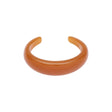 Orange Asha armbånd i chunky resin fra Pico Copenhagen på hvid baggrund.