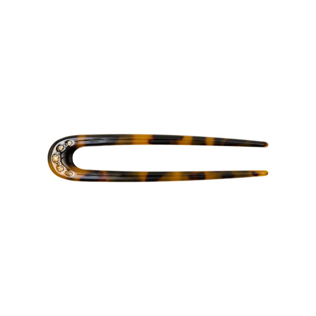 Sunny Crystal hårnål i leo-print fra Pico Copenhagen med fem dekorative krystaller.