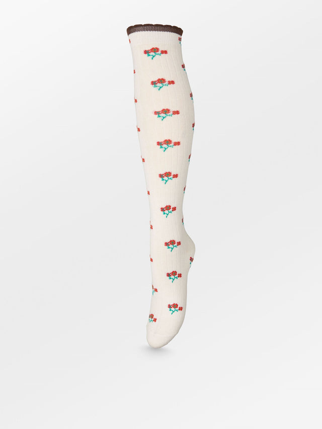 Hvid knæhøj strømpe med blomsterprint fra Becksöndergaard.