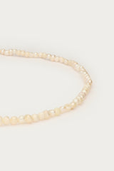 Freshwater pearls and locket necklace closeup