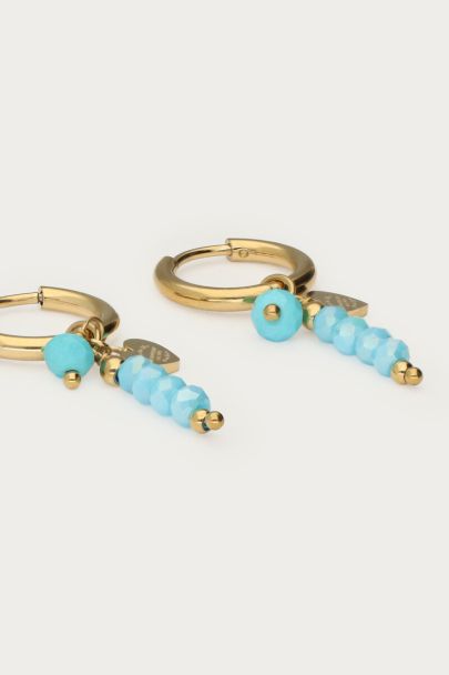 Tropical hoop earrings with blue beads detail